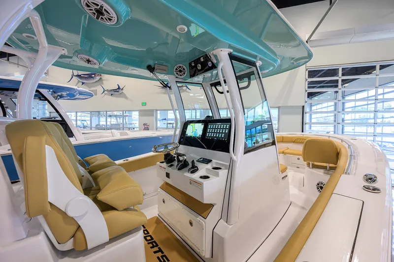 Slide: The Image of 2025 Sportsman Open 282 Center Console boat interior with modern helm and seating. - 14