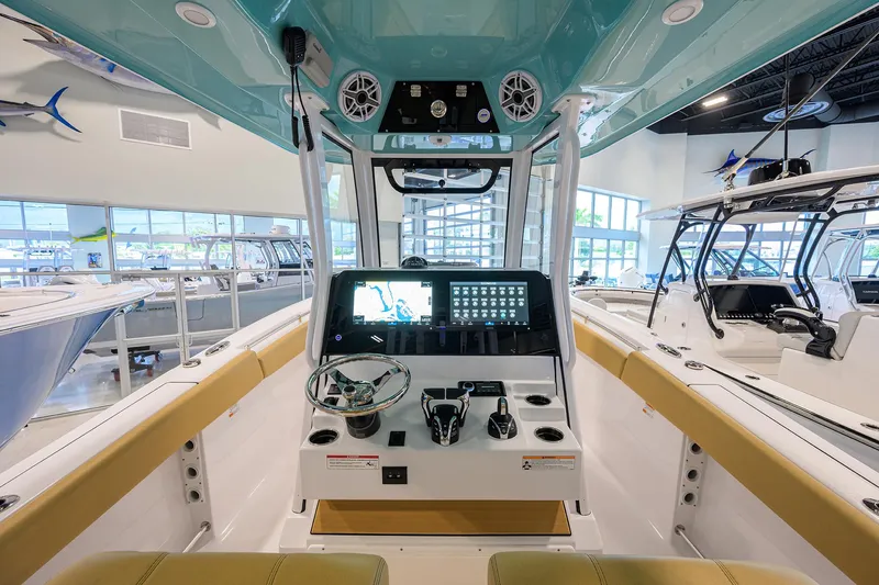 Slide: The Image of 2025 Sportsman Open 282 Center Console boat interior with modern dashboard and controls. - 15