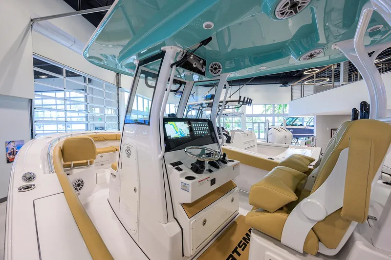 Slide: The Image of 2025 Sportsman Open 282 Center Console boat interior with modern dashboard and seating. - 16