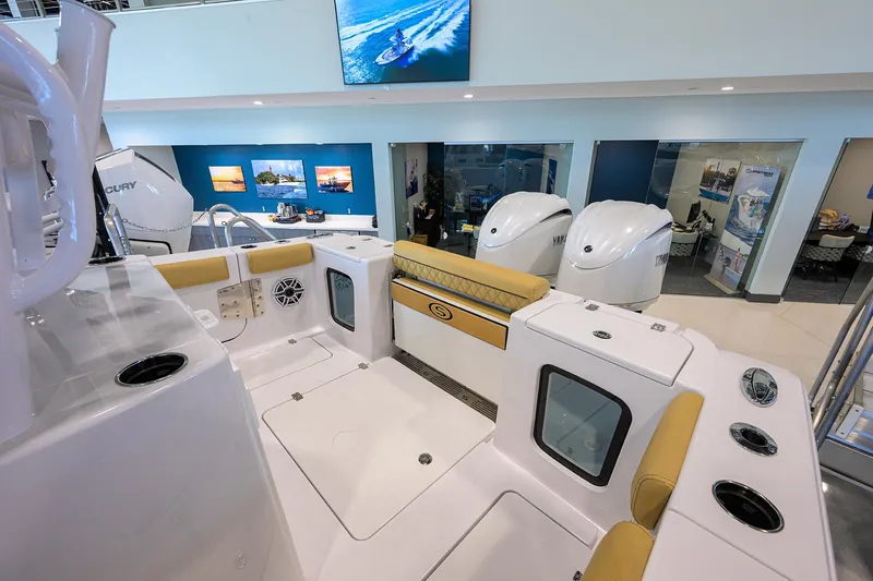 Slide: The Image of 2025 Sportsman Open 282 Center Console boat interior with seating and engine display. - 20
