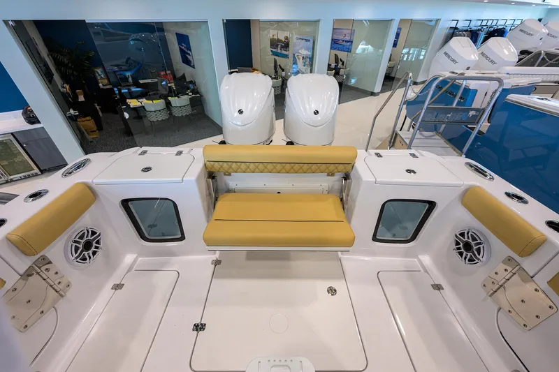 Slide: The Image of 2025 Sportsman Open 282 Center Console boat interior with seating and dual engines. - 23