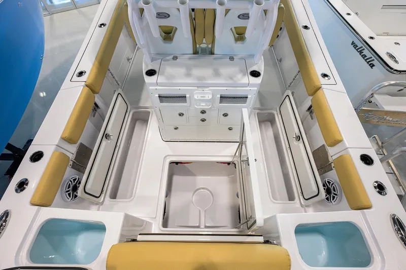 Slide: The Image of 2025 Sportsman Open 282 Center Console boat interior with seating and storage compartments. - 28