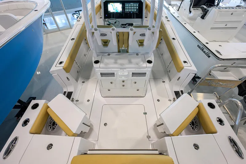 Slide: The Image of 2025 Sportsman Open 282 Center Console boat interior with yellow seating and modern dashboard. - 29