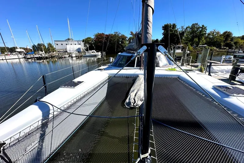 Slide: The Image of 2007 Morrelli & Melvin Shooting Star catamaran docked in a serene marina. - 19