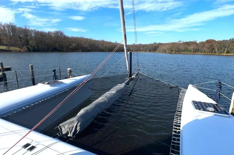 Slide: The Image of 2007 Morrelli & Melvin Shooting Star catamaran on a serene lake. - 23