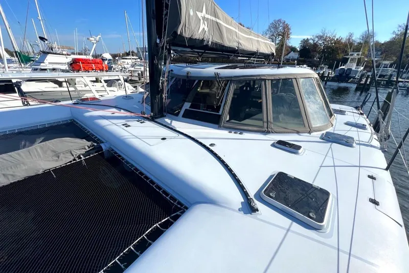 Slide: The Image of 2007 Morrelli & Melvin Shooting Star yacht docked at marina, featuring sleek design and spacious deck. - 24