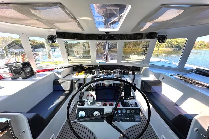 Slide: The Image of Interior of 2007 Morrelli & Melvin Shooting Star yacht cockpit with steering wheel and controls. - 26
