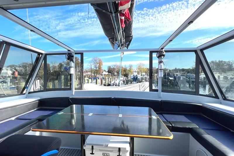 Slide: The Image of Interior of 2007 Morrelli & Melvin Shooting Star yacht with panoramic windows and seating area. - 33