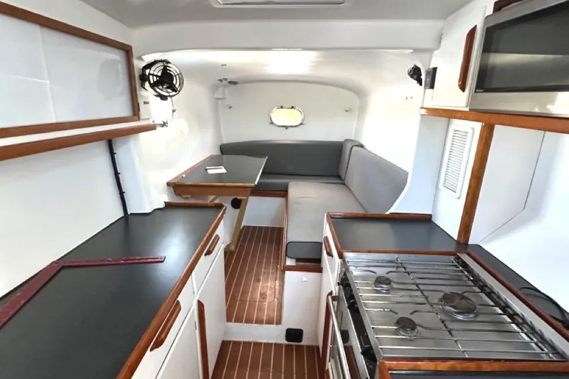 Slide: The Image of Interior of 2007 Morrelli & Melvin Shooting Star yacht with modern kitchen and seating area. - 34