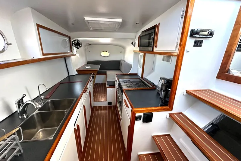 Slide: The Image of Interior of 2007 Morrelli & Melvin Shooting Star yacht with modern kitchen and wood accents. - 35
