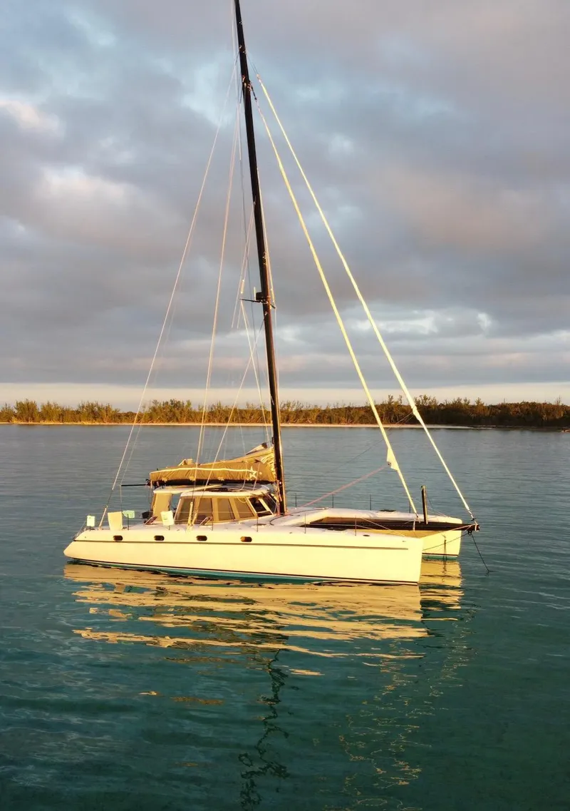 Slide: The Image of Sailing catamaran Morrelli & Melvin Shooting Star 2007 on calm water at sunset. - 4