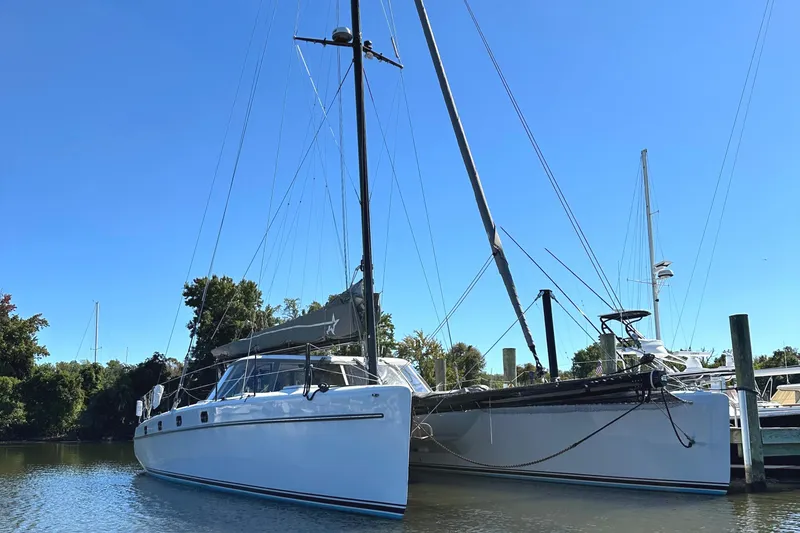 Slide: The Image of Morrelli & Melvin 2007 Shooting Star catamaran docked on a sunny day. - 5