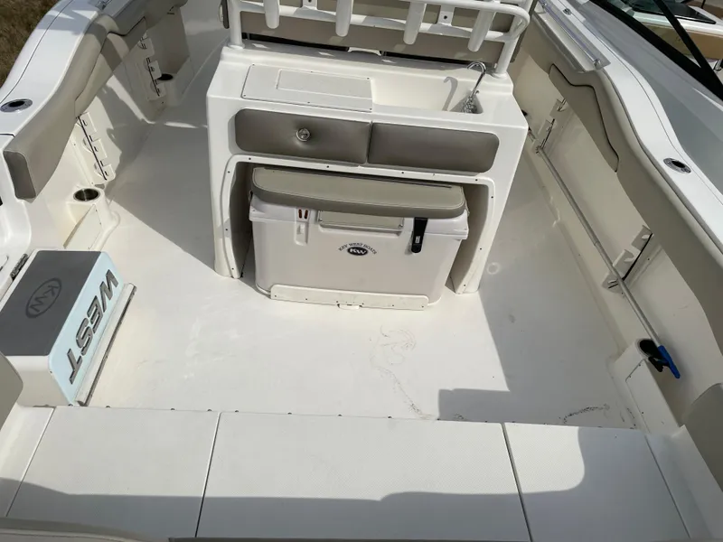 Slide: The Image of 2022 Key West 263 FS boat interior with seating and storage. - 11