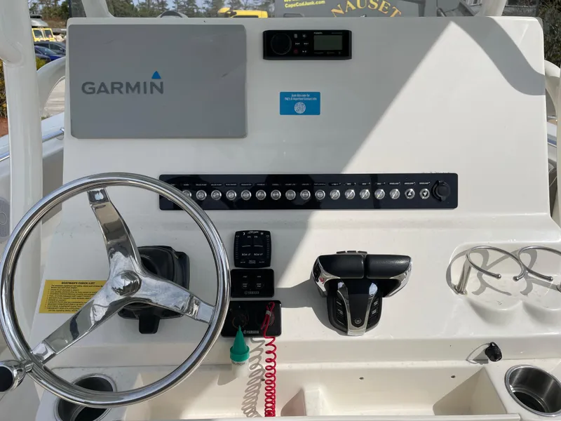 Slide: The Image of 2022 Key West 263 FS boat dashboard with Garmin navigation system and steering wheel. - 4
