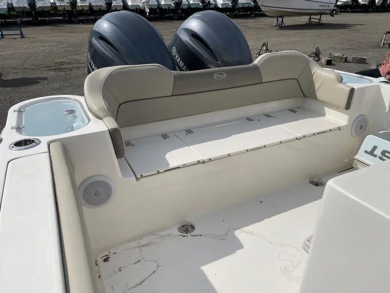 Slide: The Image of 2022 Key West 263 FS boat with dual Yamaha engines and spacious seating area. - 5