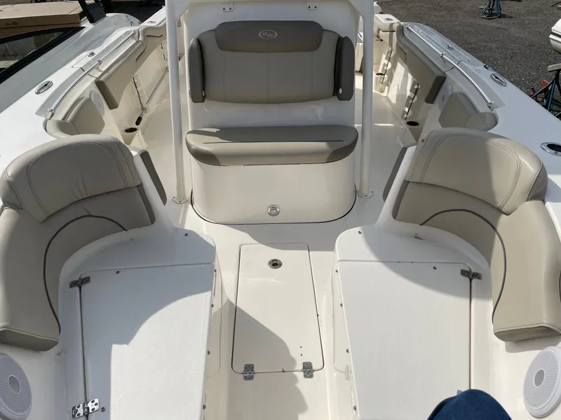 Slide: The Image of 2022 Key West 263 FS boat interior with cushioned seating and storage compartments. - 7