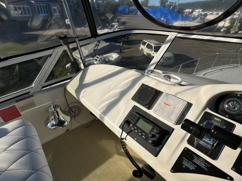 Slide: The Image of Interior view of 1996 Sea Ray 400 Sedan Bridge yacht cockpit with navigation equipment. - 18