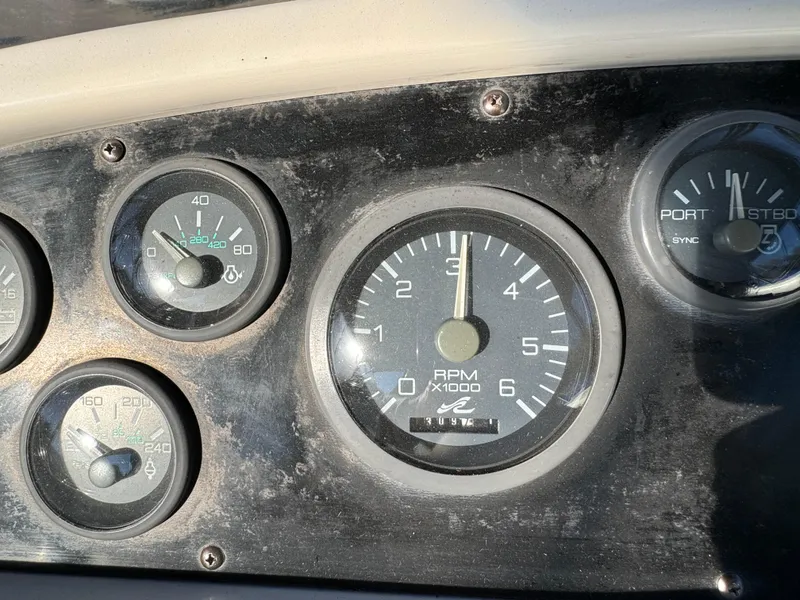 Slide: The Image of Dashboard gauges of a 1996 Sea Ray 400 Sedan Bridge boat. - 19