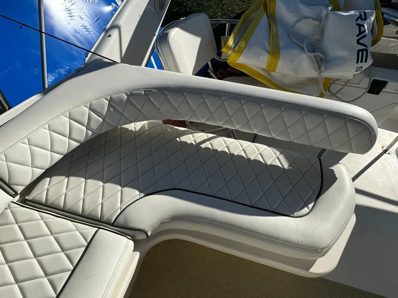 Slide: The Image of Luxurious white seating on 1996 Sea Ray 400 Sedan Bridge yacht. - 24