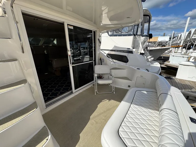 Slide: The Image of 1996 Sea Ray 400 Sedan Bridge yacht with spacious deck and comfortable seating. - 27