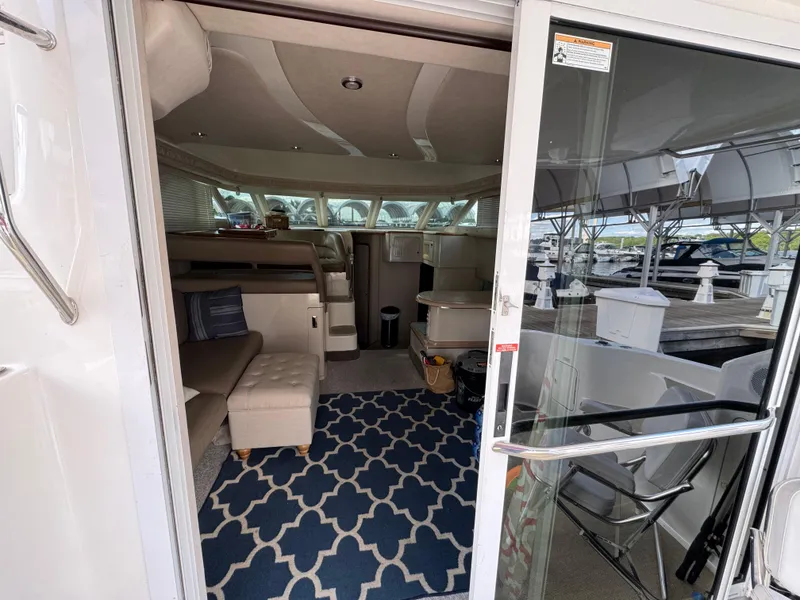 Slide: The Image of Interior view of 1996 Sea Ray 400 Sedan Bridge yacht with cozy seating and nautical decor. - 29