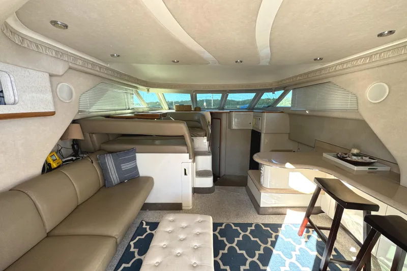 Slide: The Image of Luxurious interior of a 1996 Sea Ray 400 Sedan Bridge yacht with elegant seating and decor. - 31