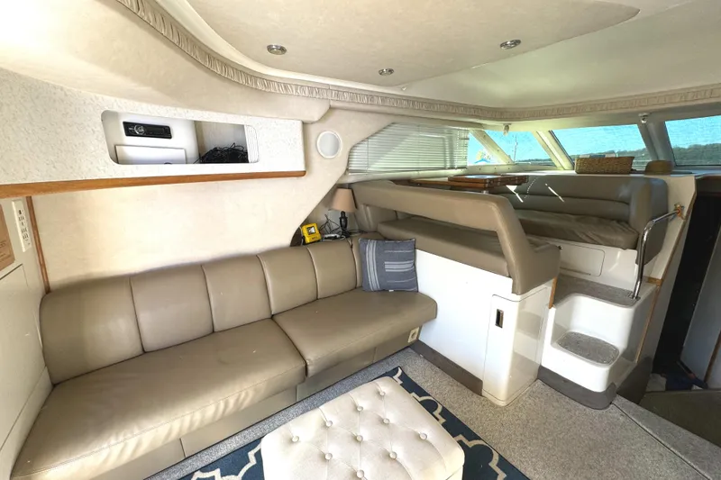 Slide: The Image of Luxurious interior of a 1996 Sea Ray 400 Sedan Bridge yacht with leather seating. - 34