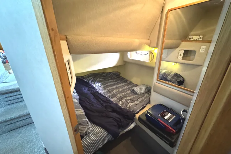 Slide: The Image of Cozy cabin interior of 1996 Sea Ray 400 Sedan Bridge with bed and mirror. - 43