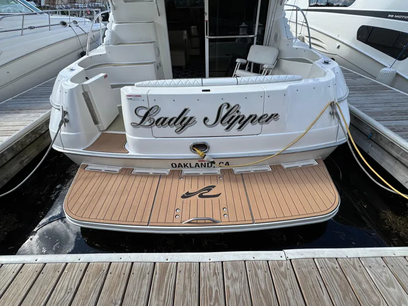 Slide: The Image of 1996 Sea Ray 400 Sedan Bridge docked, rear view with "Lady Slipper" nameplate, Oakland, CA. - 6
