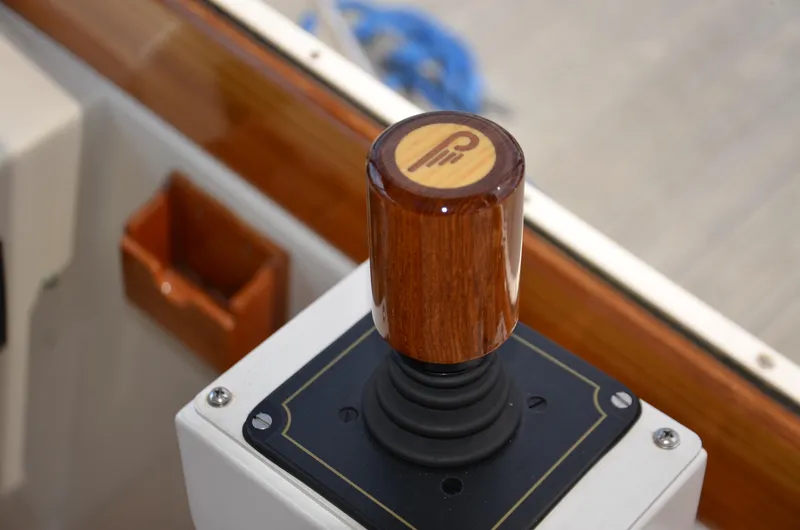 Slide: The Image of Joystick control on 2003 Little Harbor WhisperJet 38 boat, featuring a wooden handle. - 10