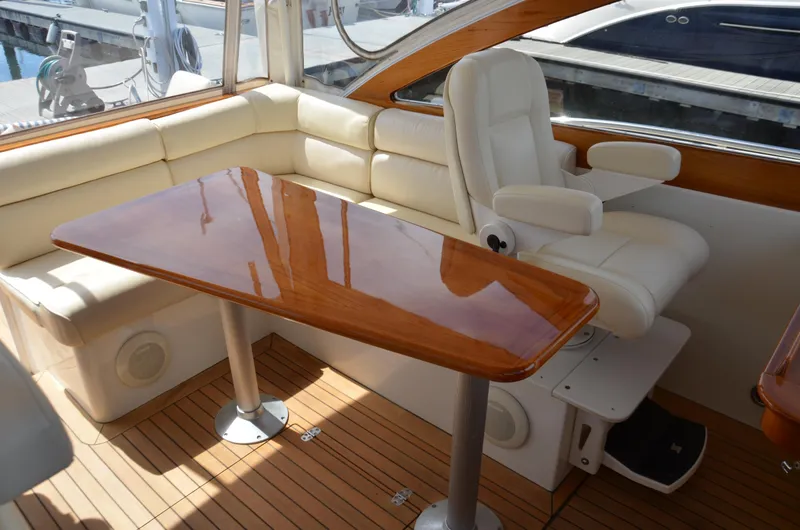 Slide: The Image of 2003 Little Harbor WhisperJet 38 interior with wood accents and seating. - 14