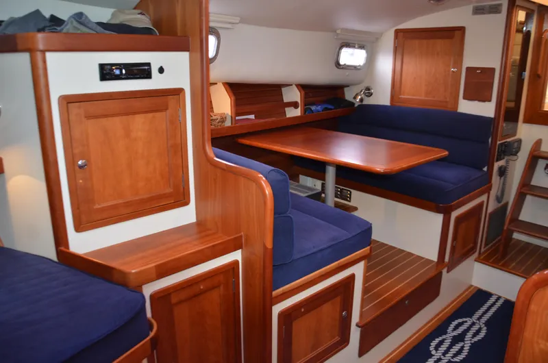 Slide: The Image of Interior of 2003 Little Harbor WhisperJet 38, featuring wood finishes and nautical decor. - 16