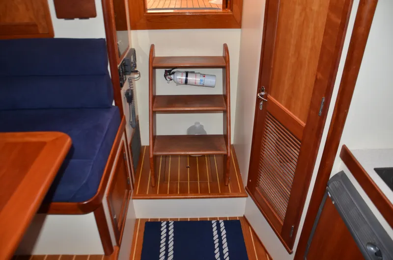 Slide: The Image of 2003 Little Harbor WhisperJet 38 bathroom with sink, mirror, and wooden cabinetry. - 22