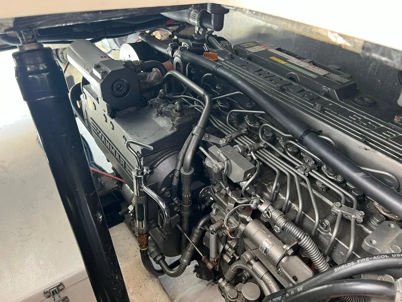 Slide: The Image of Engine compartment of a 2003 Little Harbor WhisperJet 38 boat, showcasing detailed mechanical components. - 24