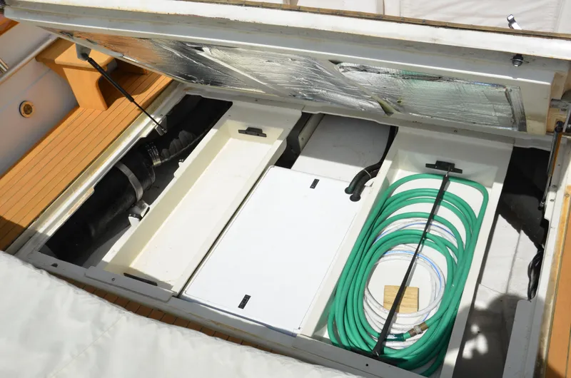 Slide: The Image of Open engine compartment of 2003 Little Harbor WhisperJet 38 with organized hoses and components. - 25