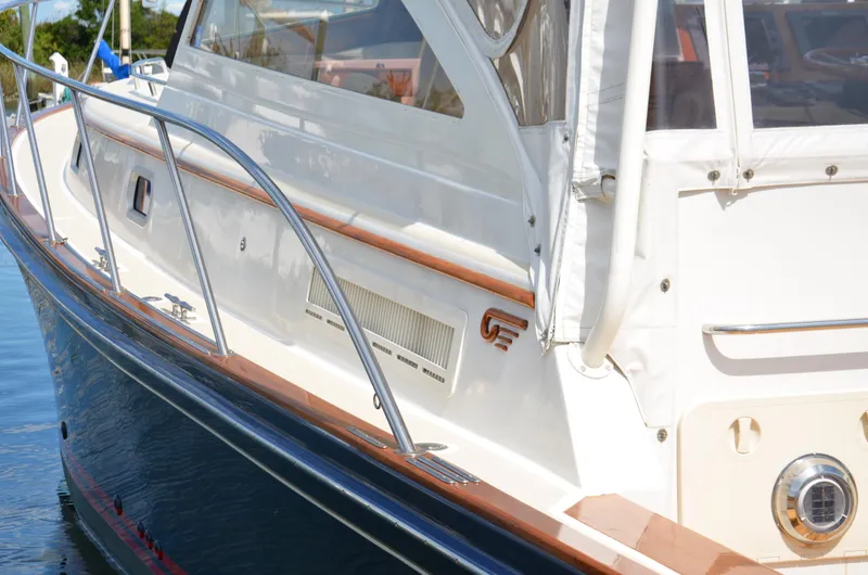 Slide: The Image of 2003 Little Harbor WhisperJet 38 yacht, featuring sleek design and polished wood accents. - 26