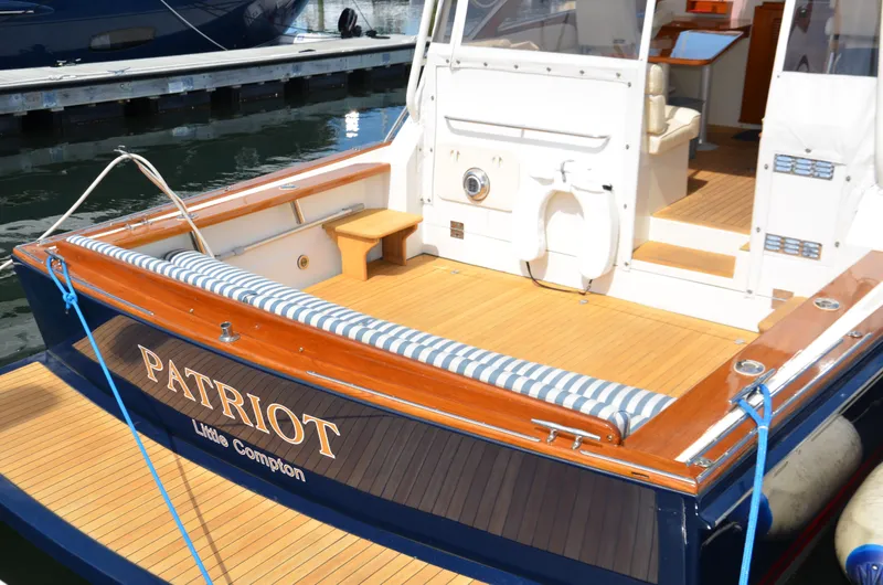 Slide: The Image of 2003 Little Harbor WhisperJet 38 yacht interior with wooden cabinetry and compact kitchen area. - 3