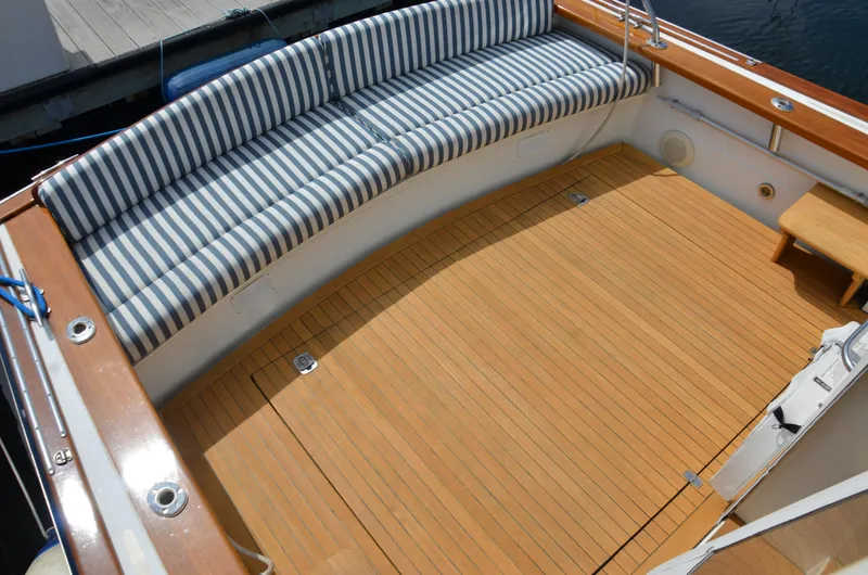 Slide: The Image of 2003 Little Harbor WhisperJet 38 docked in a marina, showcasing sleek design and craftsmanship. - 4