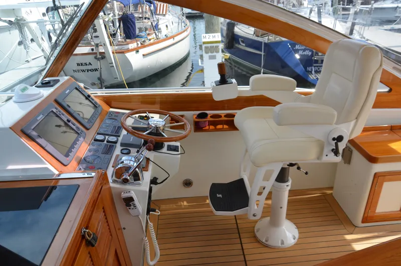 Slide: The Image of 2003 Little Harbor WhisperJet 38 boat with striped seating and wooden deck. - 7