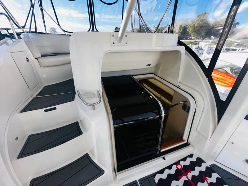 Slide: The Image of 2005 Meridian 368 Motor Yacht interior with stairs and seating area. - 12