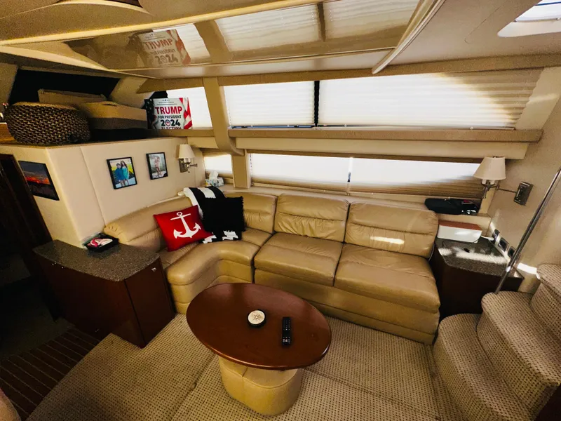 Slide: The Image of Luxurious interior of 2005 Meridian 368 Motor Yacht with beige seating and nautical decor. - 15