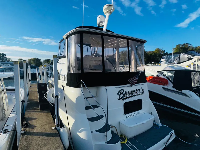 Slide: The Image of 2005 Meridian 368 Motor Yacht docked under a clear blue sky. - 2