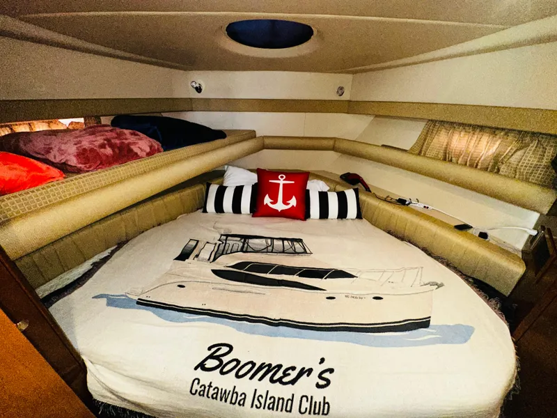 Slide: The Image of Cozy cabin interior of 2005 Meridian 368 Motor Yacht with nautical-themed bedding. - 21