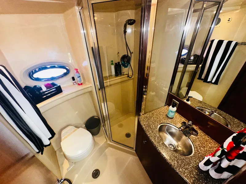 Slide: The Image of Luxurious bathroom in 2005 Meridian 368 Motor Yacht with shower, sink, and toilet. - 22