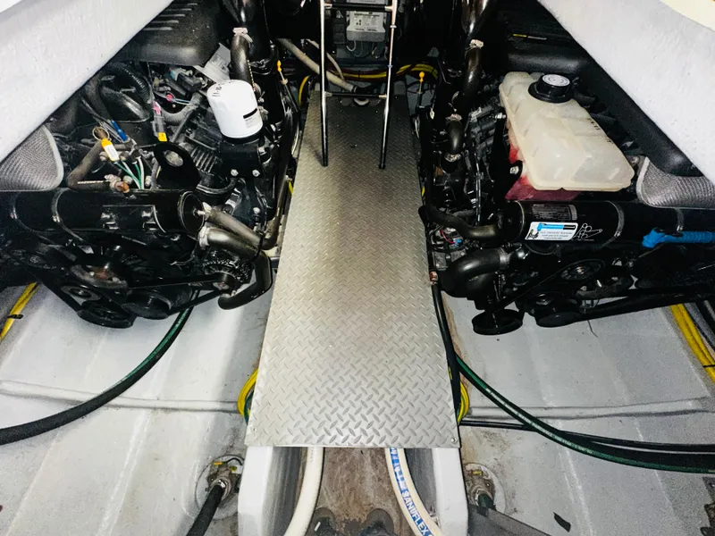 Slide: The Image of Engine room of a 2005 Meridian 368 Motor Yacht with visible components and walkway. - 24