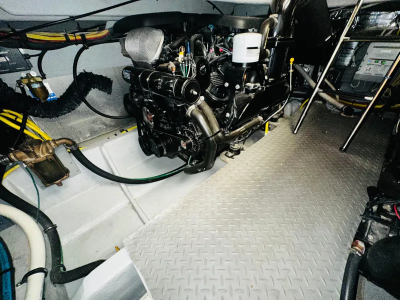 Slide: The Image of Engine room of a 2005 Meridian 368 Motor Yacht with visible machinery and wiring. - 25