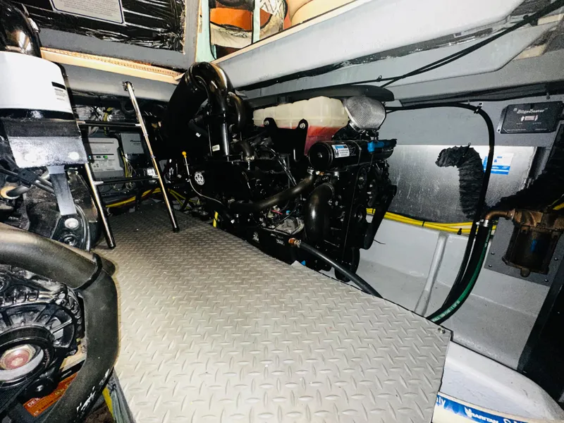 Slide: The Image of Engine room of a 2005 Meridian 368 Motor Yacht with visible machinery and components. - 26
