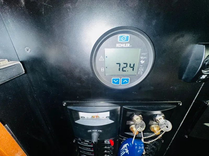 Slide: The Image of Control panel of a 2005 Meridian 368 Motor Yacht with Kohler display showing 72.4 volts. - 28