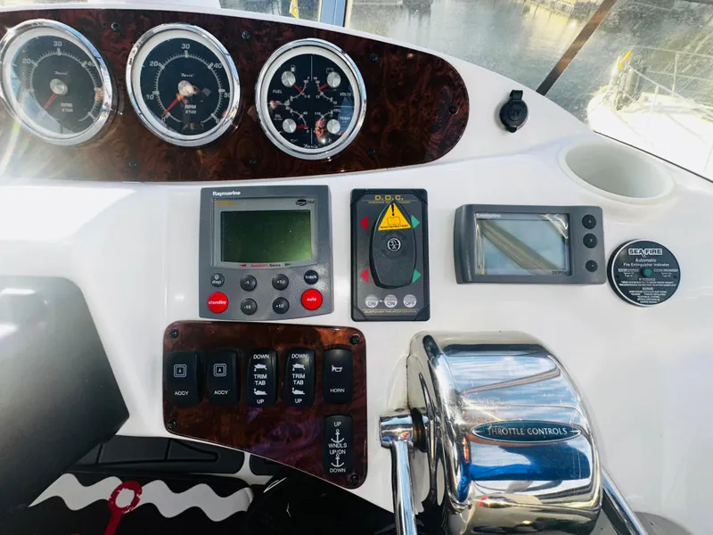 Slide: The Image of 2005 Meridian 368 Motor Yacht dashboard with gauges, controls, and navigation equipment. - 7