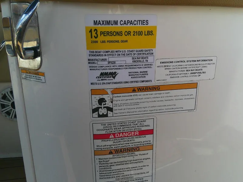 Slide: The Image of Capacity warning label on 2018 Sea Ray SPX 230 boat, maximum 13 persons or 2100 lbs. - 12